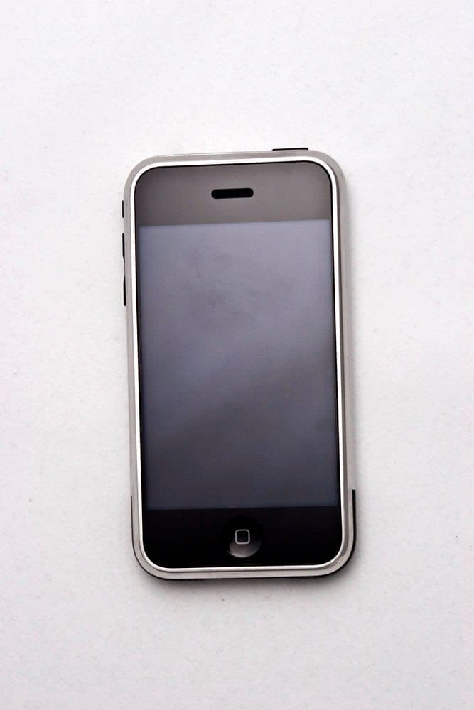 Original iPhone front view with home screen