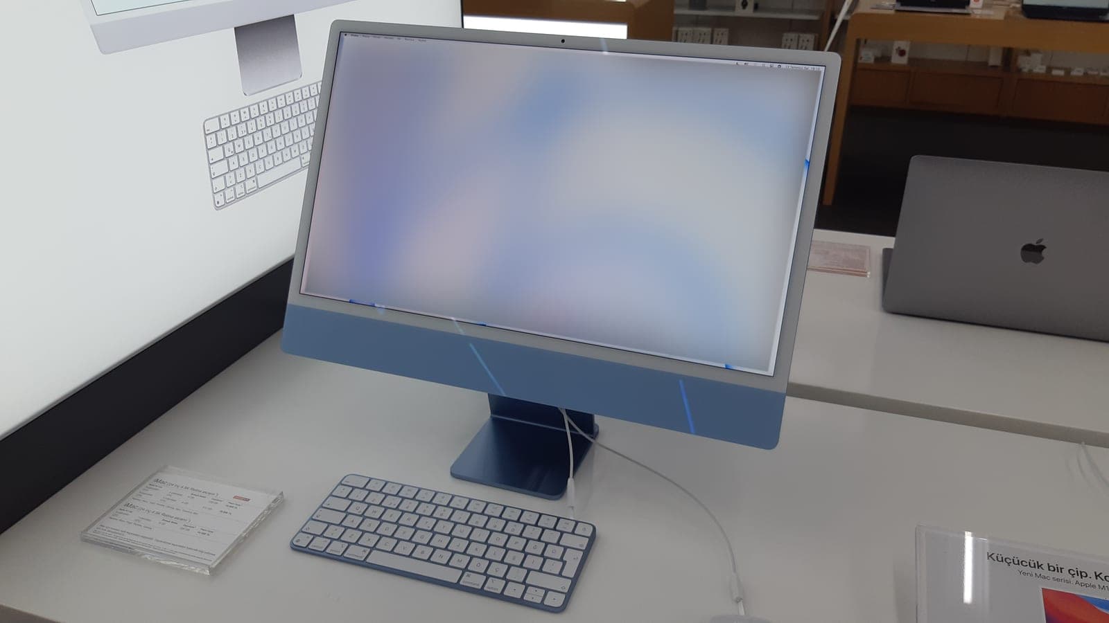 Blue 24-inch iMac M1 on a desk